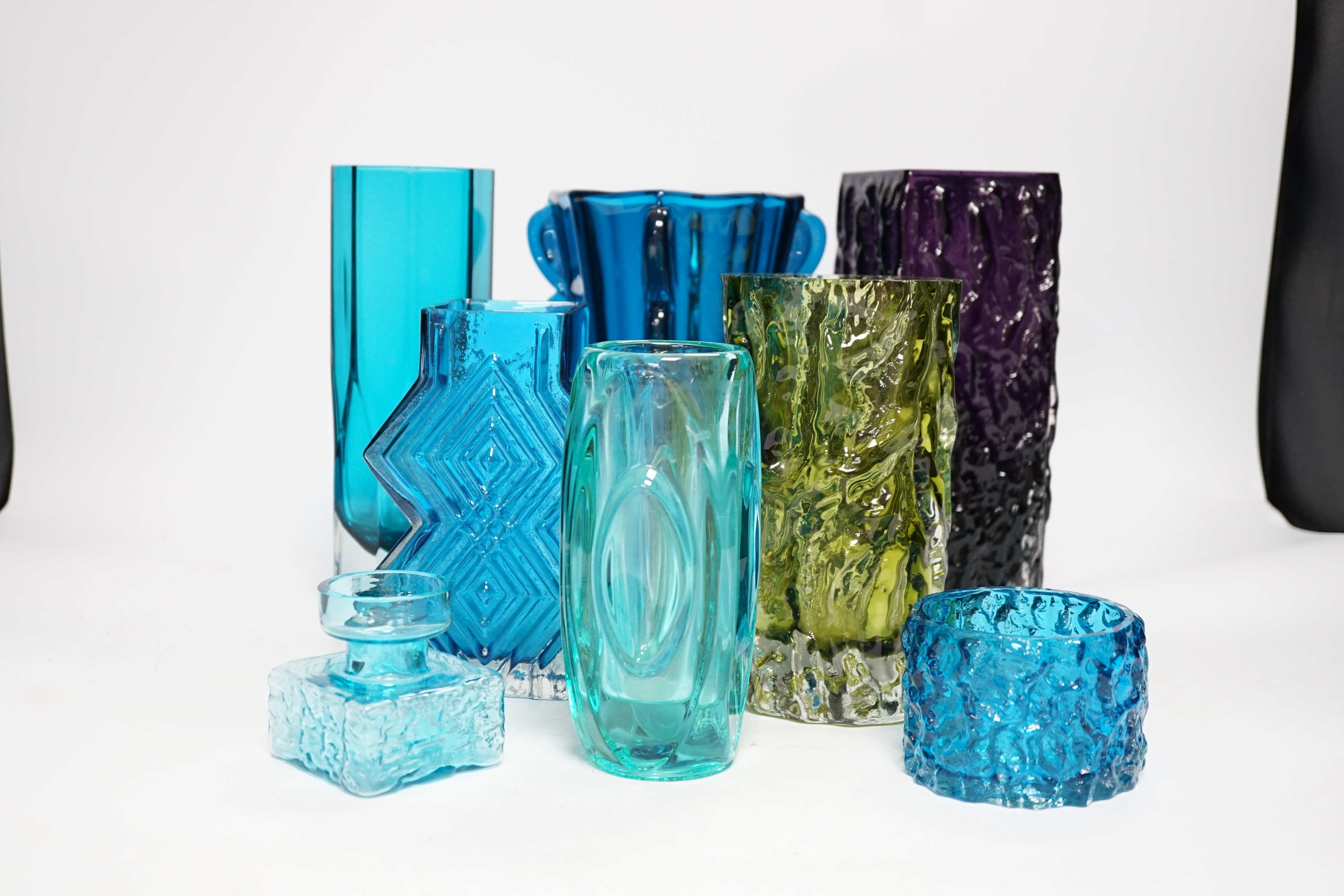 Eight coloured glass vases, including Whitefriars mobile phone vase in kingfisher blue, 22cm high